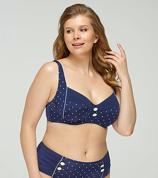 Тъмносиньо горнище на бански на бели точки снимка