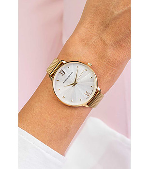 Златист дамски часовник с ефектен релеф на циферблата снимка