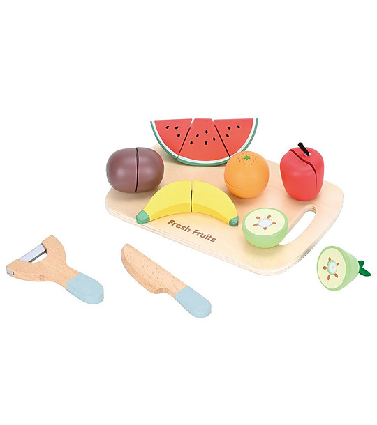 Дървени плодове с дъска за рязане снимка