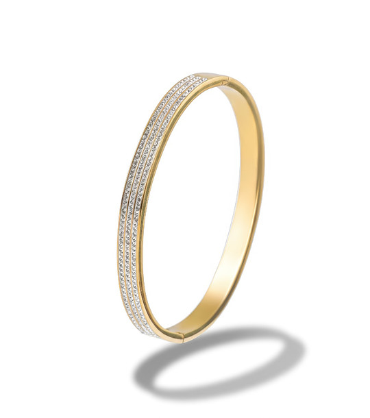 Дамска златиста твърда гривна с кристали снимка