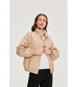 Бежово дамско яке с ластичен подгъв снимка